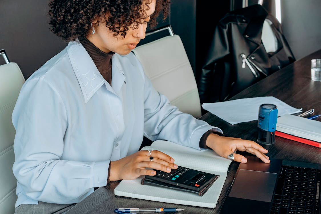 An accountant using a calculator